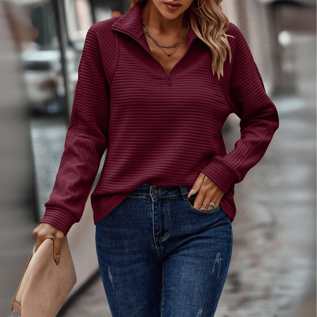 Women's ribbed half-zip pullover sweater with soft knit texture and minimalist everyday style