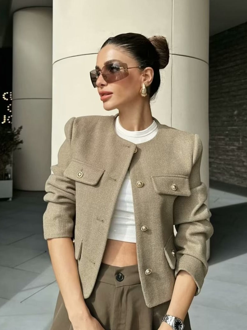 Ivory textured woven cropped jacket with boxy cut, gold-trimmed pearl buttons, elegant feminine style