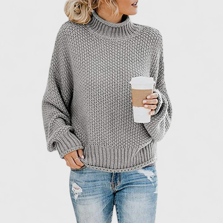 Women's chunky knit sweater relaxed fit high neck cozy layering essential in neutral tone