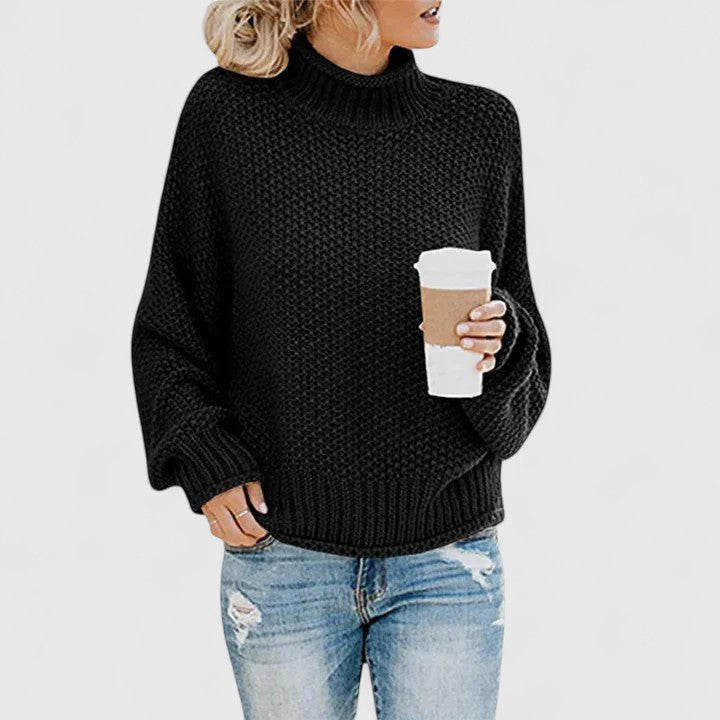 Women's chunky knit sweater in relaxed fit with high neck, cozy thick weave layering essential