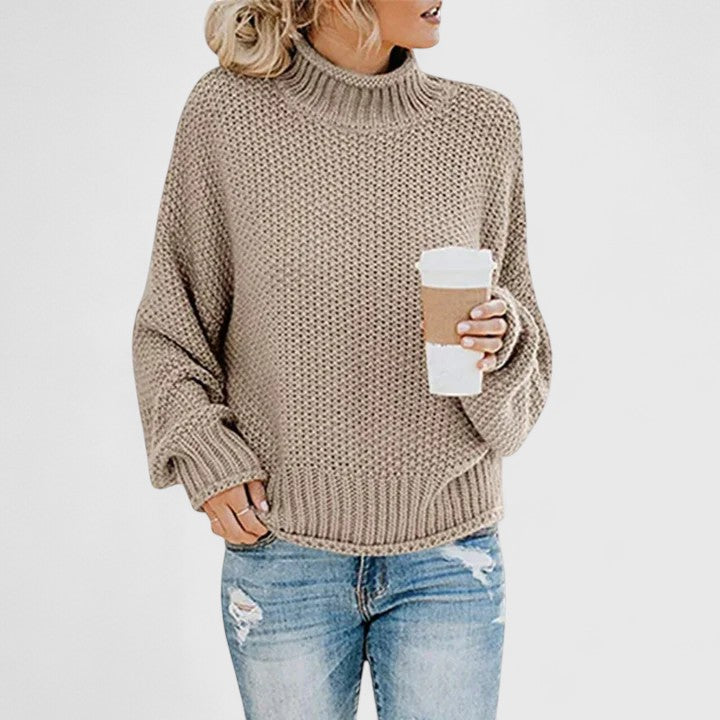 Women's chunky knit sweater in relaxed fit with high neck cozy layering essential