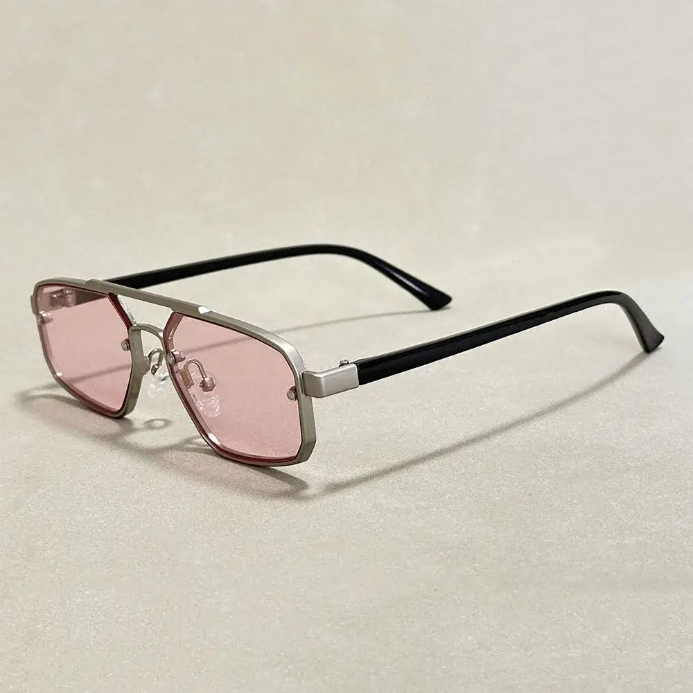 Geometric gold-tone gradient sunglasses with dark UV-protective lenses and sharp angular minimalist frame
