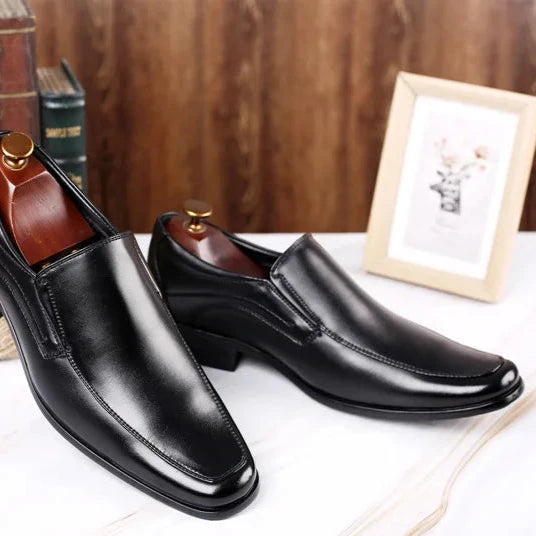 Black high-gloss leather dress shoes almond toe silhouette with premium reflective shine for professionals