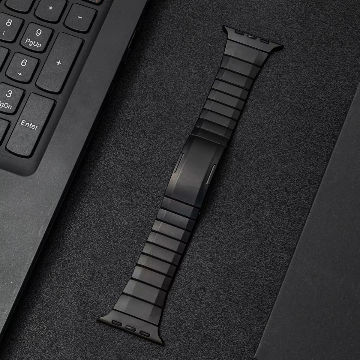 Brushed stainless steel Apple Watch link bracelet with matte finish and secure low-profile clasp