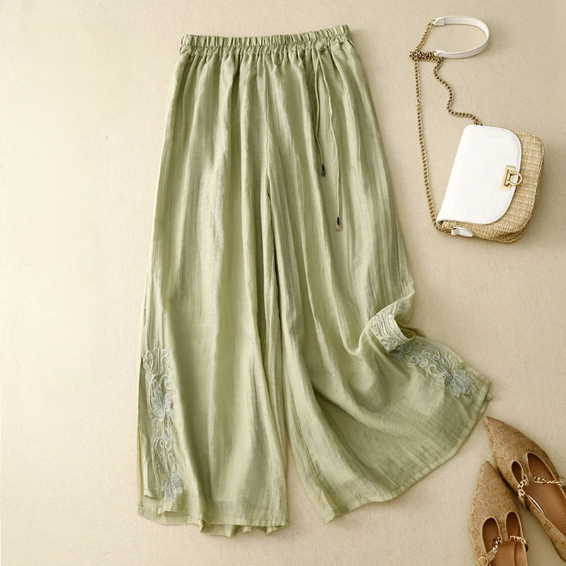 Women's wide-leg linen pants with soft floral embroidery details, breezy silhouette, everyday style