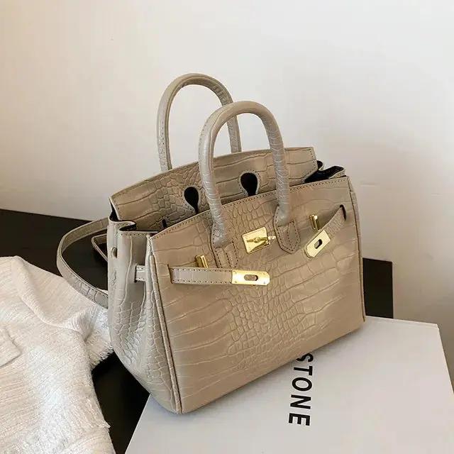 Elegant women's handbag in classic silhouette with spacious multi-compartment interior for daily use