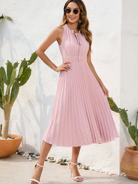 Black halter neck pleated midi dress with shoulder-baring silhouette and flowing pleat detailing