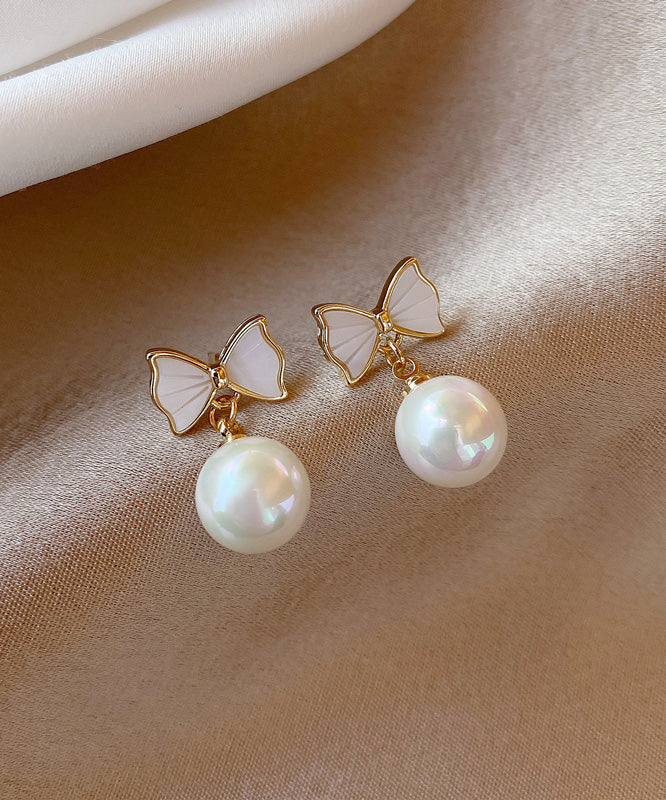 Boucles d'oreilles pendantes élégantes en alliage de cuivre blanc avec nœud en perles de coquillage - Urbann-Vibe