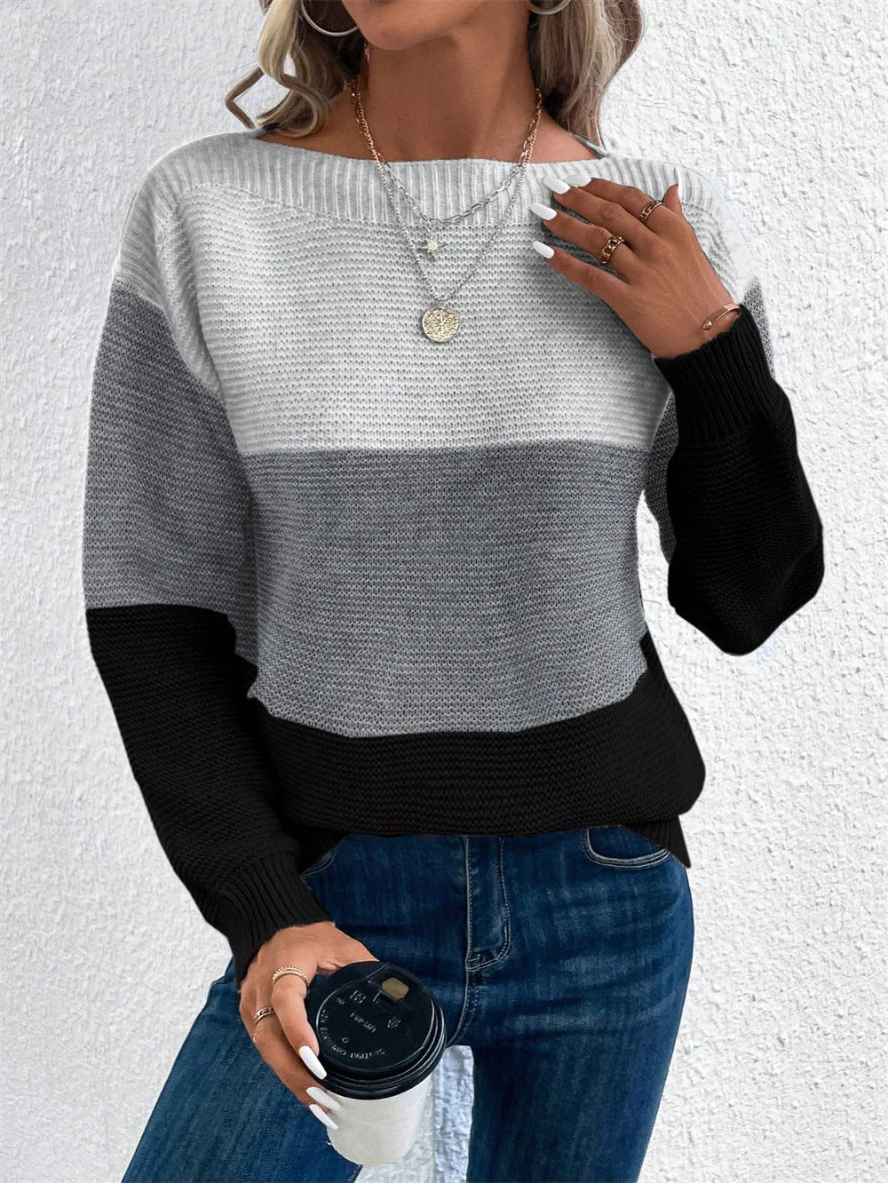 Women's relaxed patchwork knit sweater in neutral color-block tones with cozy three-color design