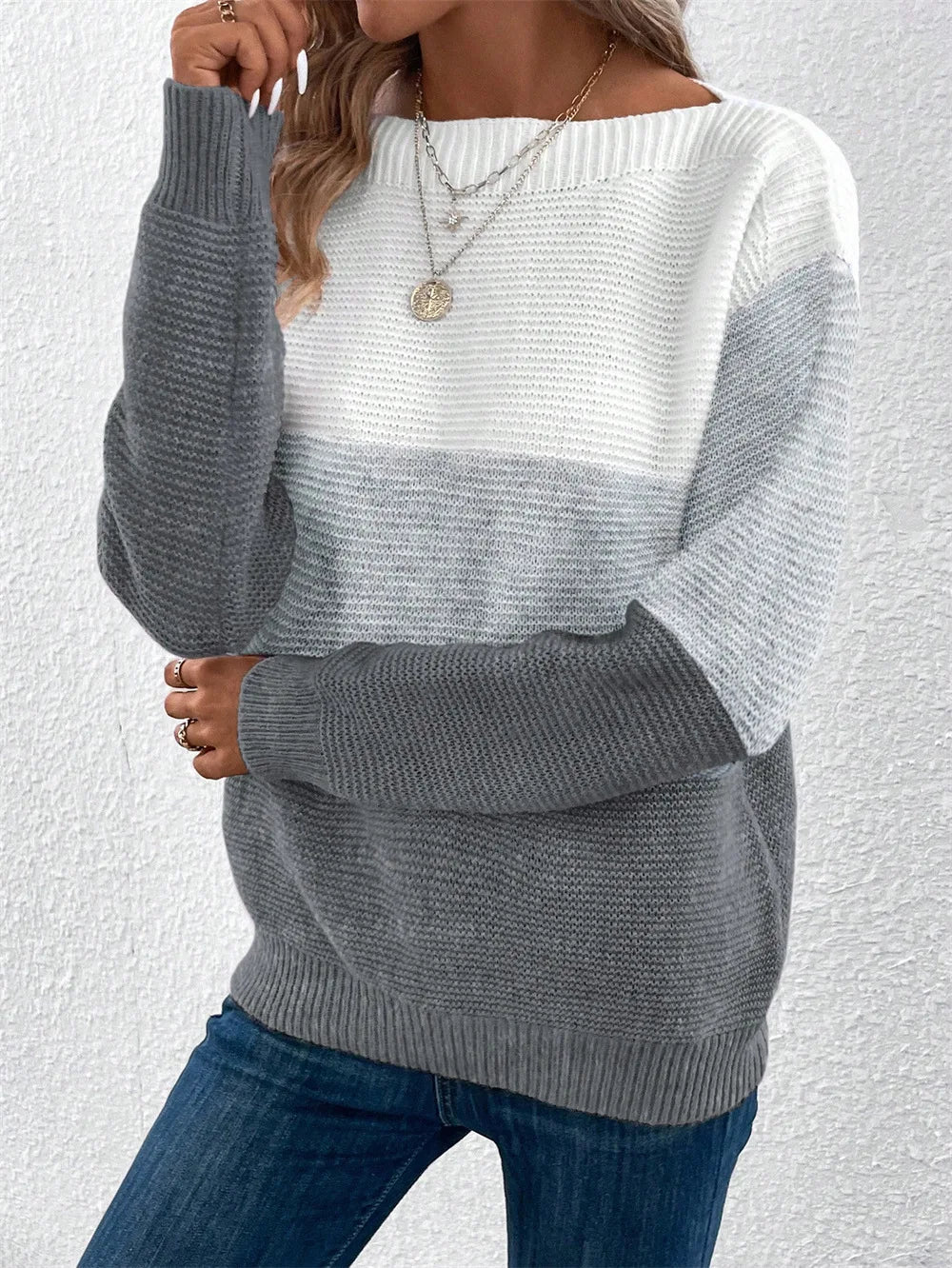 Women's relaxed-fit patchwork knit sweater in neutral color-block tones with cozy three-color design