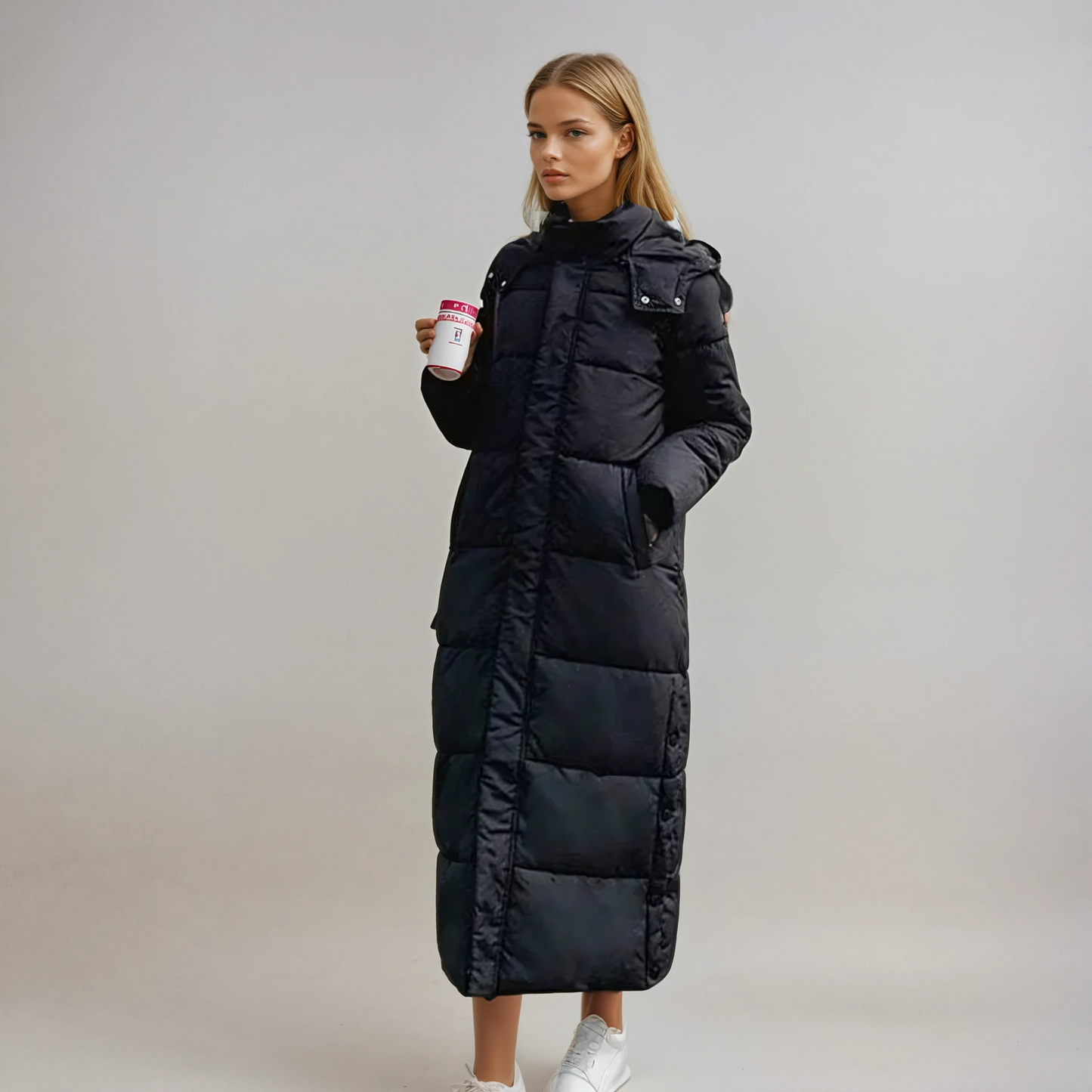 Women's long black puffer coat high collar hidden zip quilted full-length weatherproof elegant silhouette