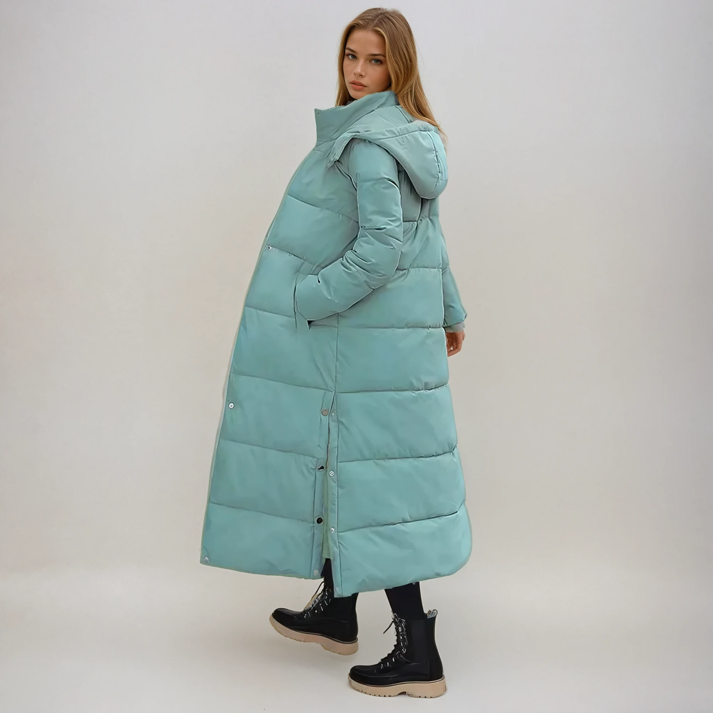 Women's long quilted puffer coat with high collar, hidden zip, full-length silhouette for cold weather