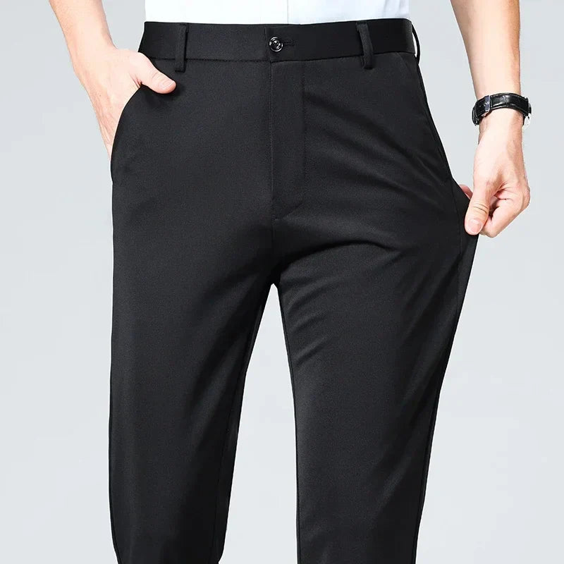 Slim fit men's dress trousers in solid color, lightweight breathable fabric with elastic waistband