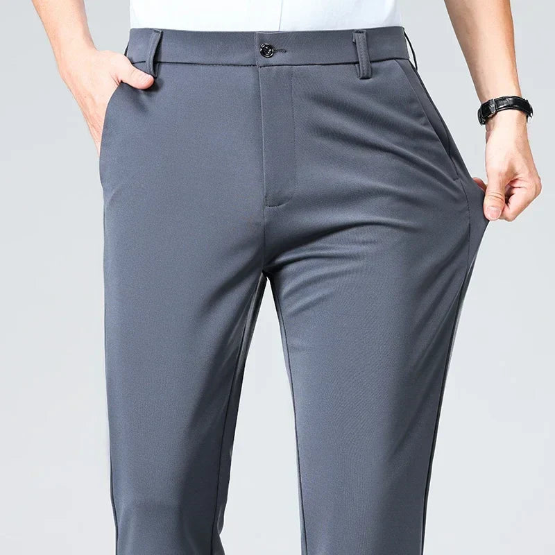Slim fit men's dress trousers in solid color, lightweight breathable fabric with elastic waistband