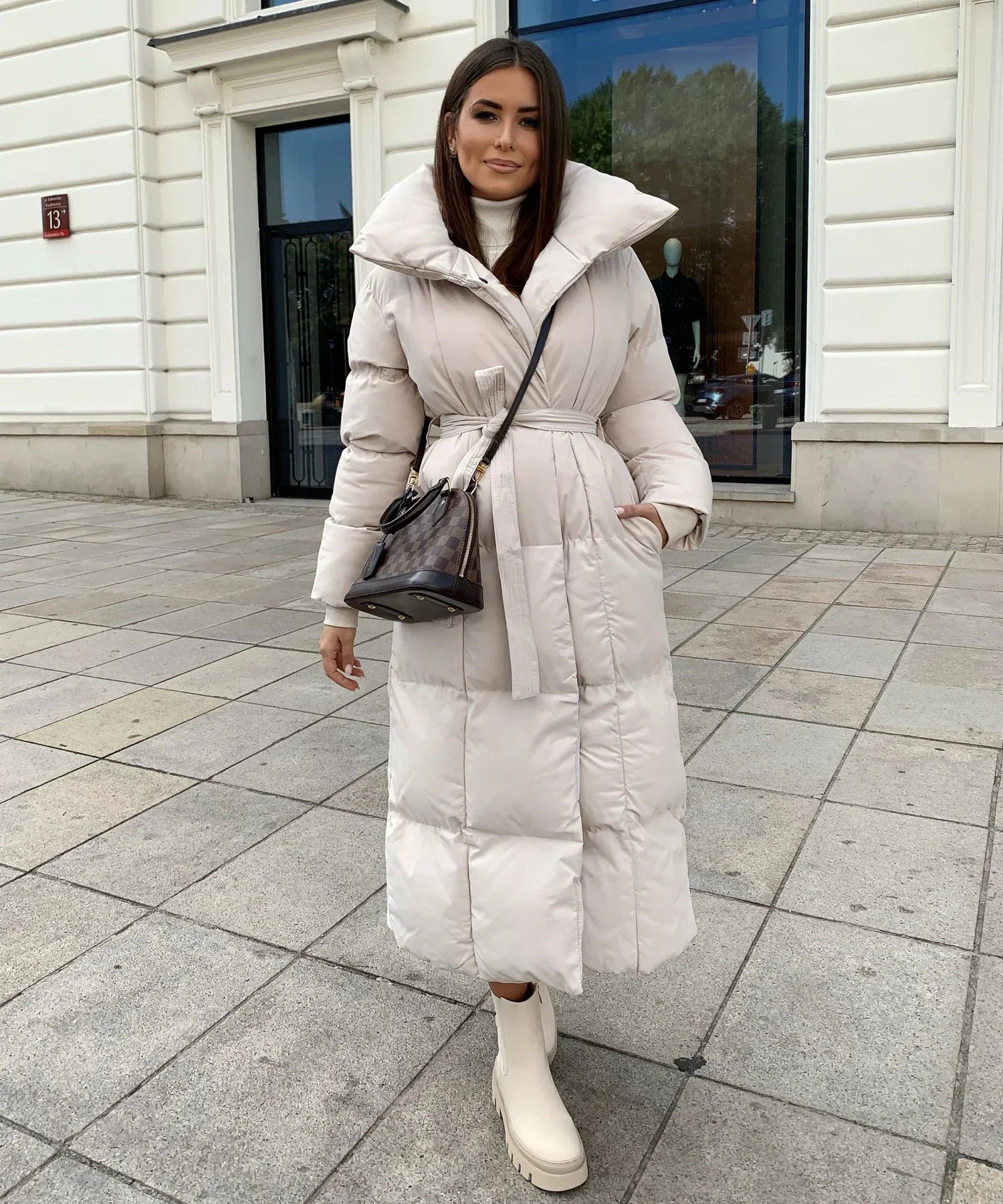 Women's long winter jacket in elegant silhouette, warm full-length coat for everyday and festive wear