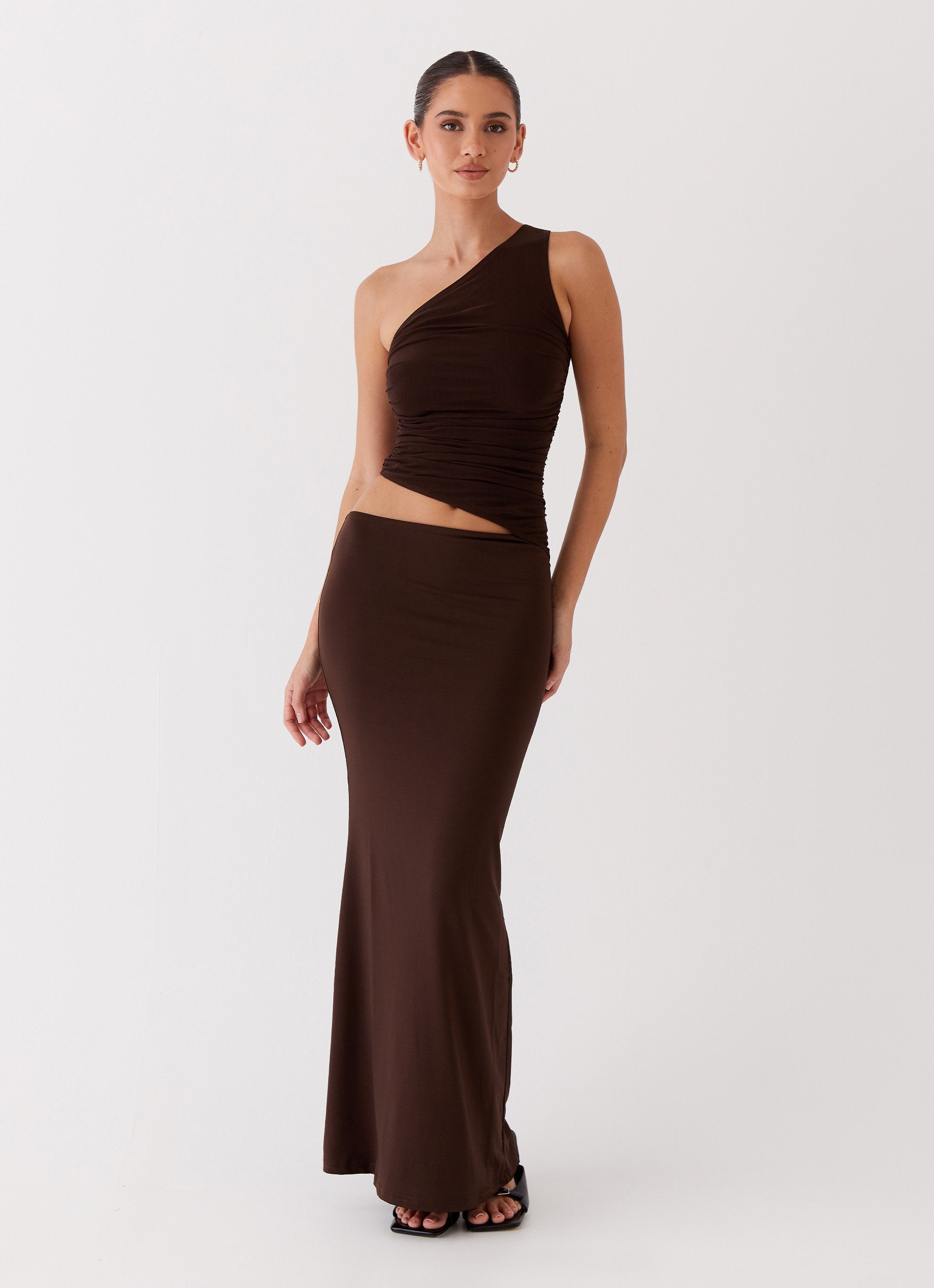 Elegant women's maxi dress with asymmetrical neckline, flowing silhouette for formal occasions