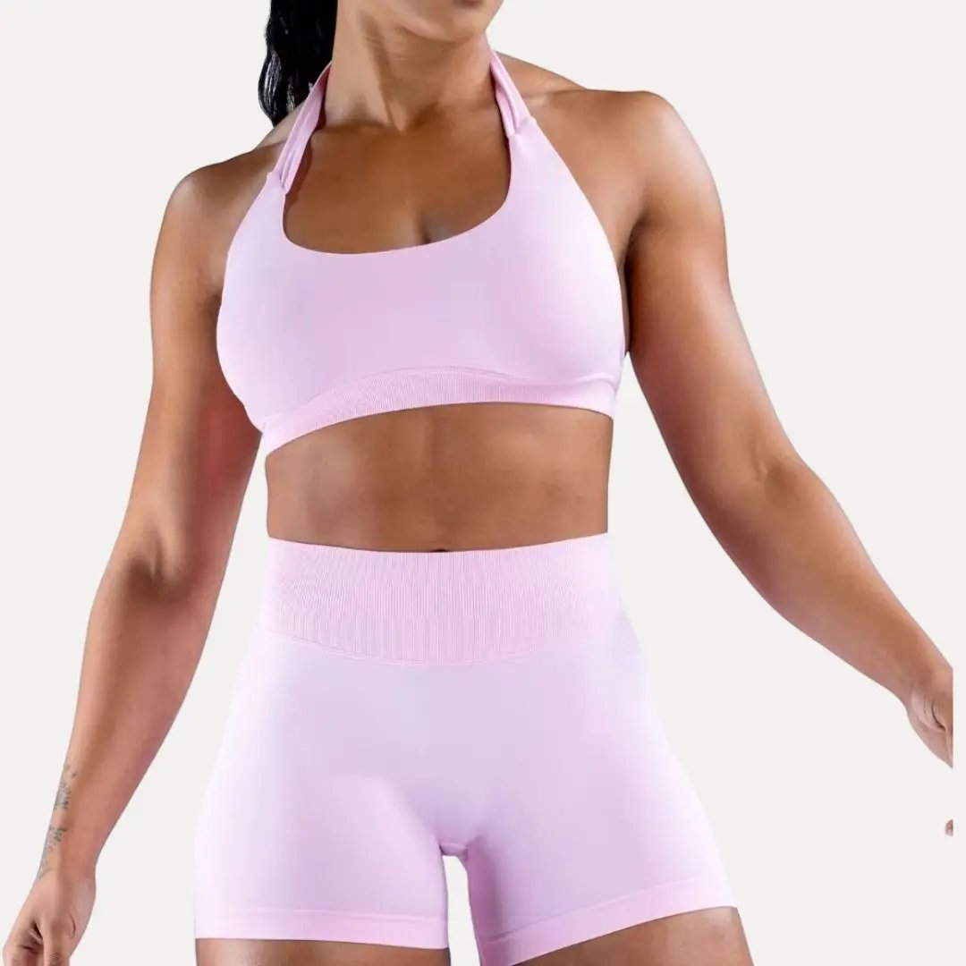 Women's seamless halter sports bra in neutral tone with sleek silhouette and secure supportive fit