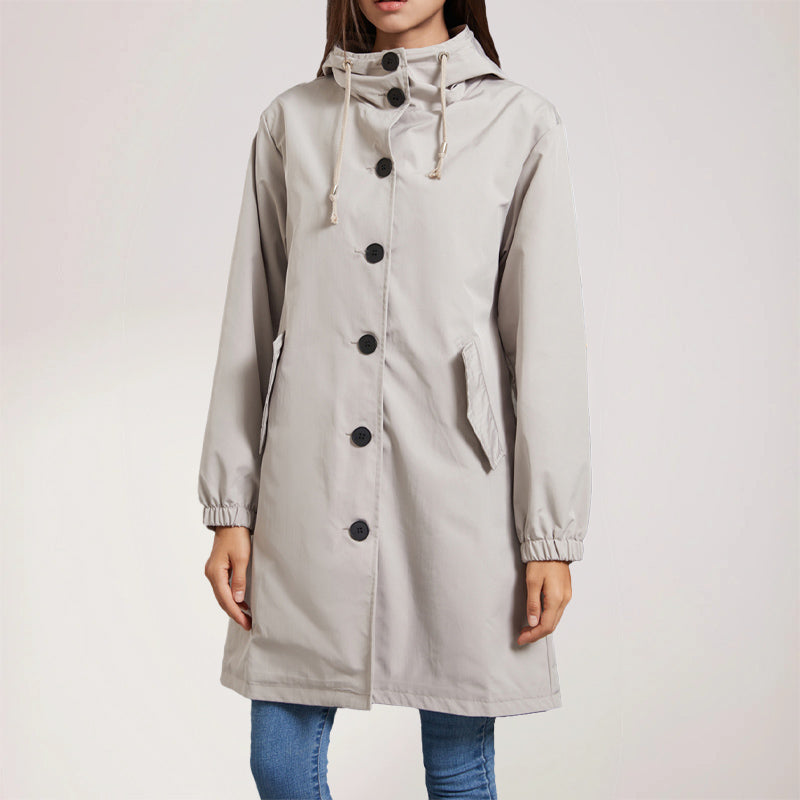 Women's beige mid-length trench coat with hood, polished lines and timeless sophisticated silhouette