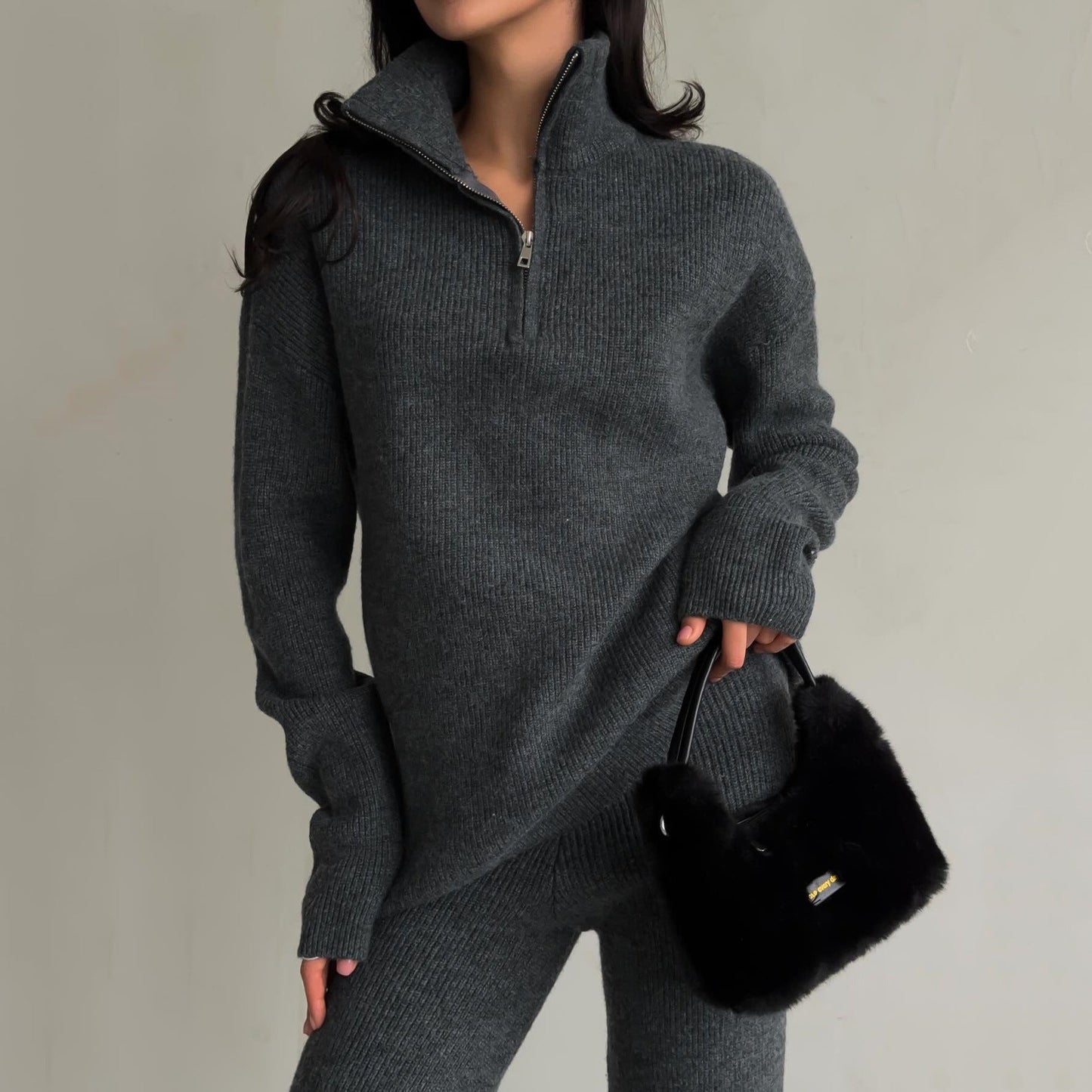 Women's beige minimalist knitted sweater and pants set with tailored cut and flawless knit finish