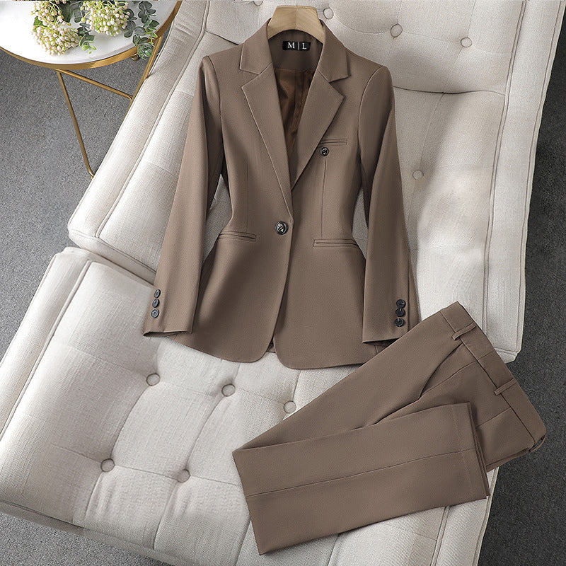 Women's black blazer and pants duo set with lapel collar, single-button closure executive business attire