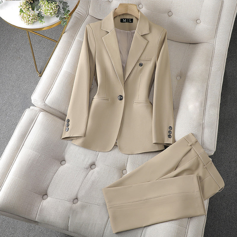 Women's black blazer and pants executive set with lapel collar and single-button closure