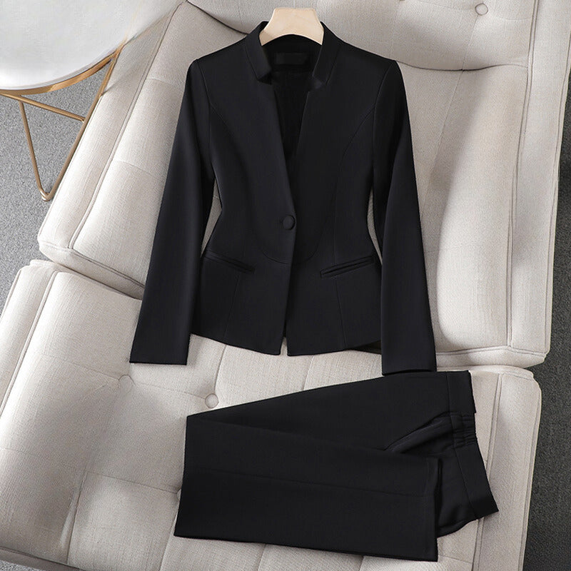 Crisp white tailored blazer and pants matching set with clean lines for professional women