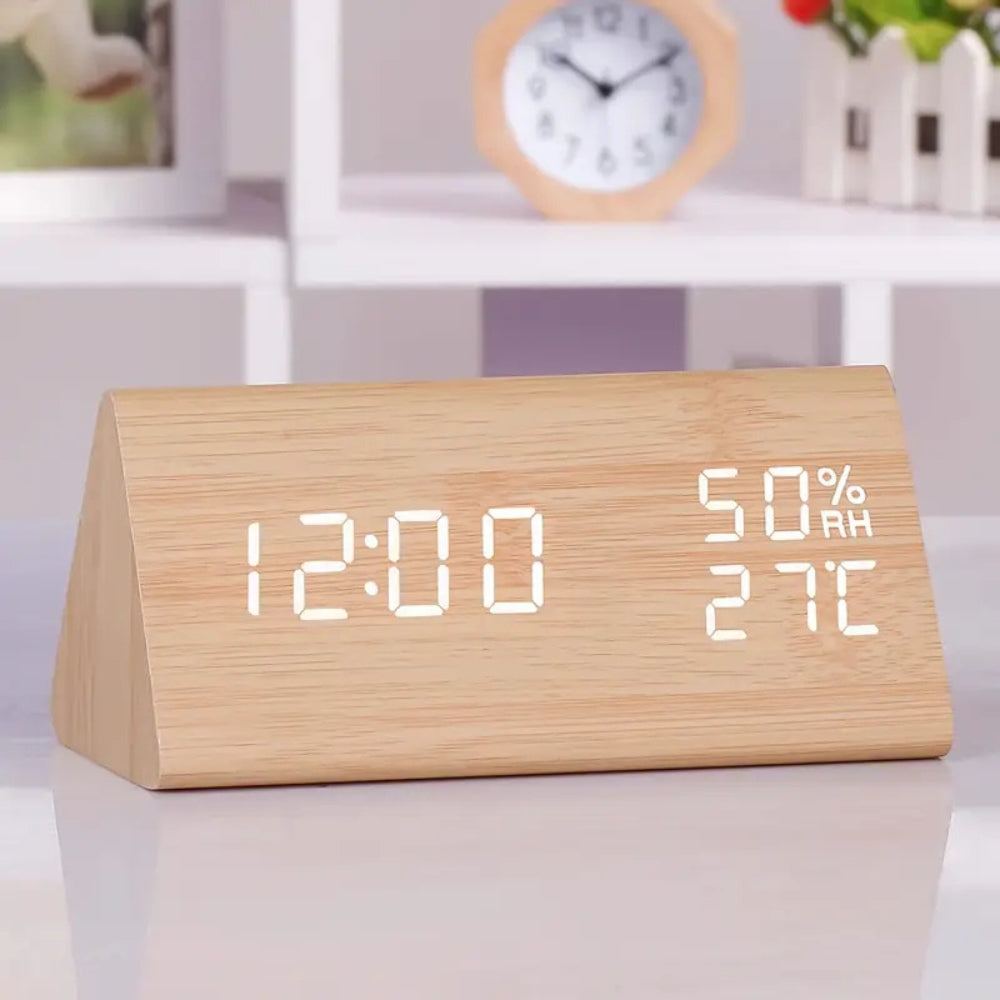 Minimalist black wood triangular LED alarm clock with temperature display, sleek modern design