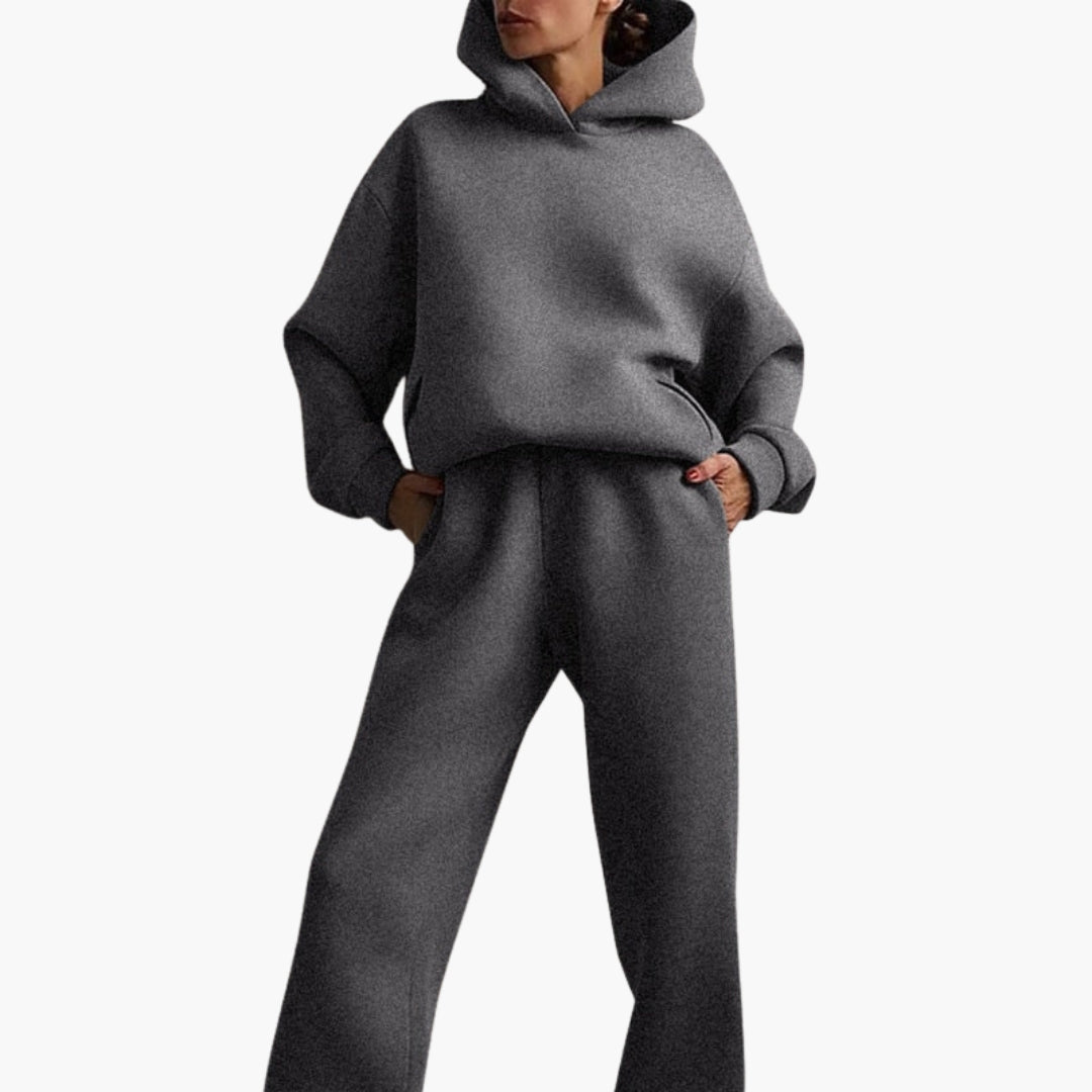 Women's gray jogging set hoodie with dropped shoulders and matching elastic waist ankle pants