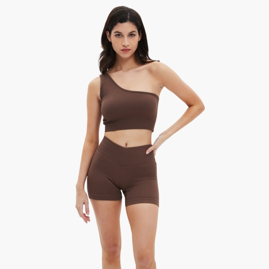 Women's ribbed one-shoulder crop top and high-waisted shorts set in matching athletic style