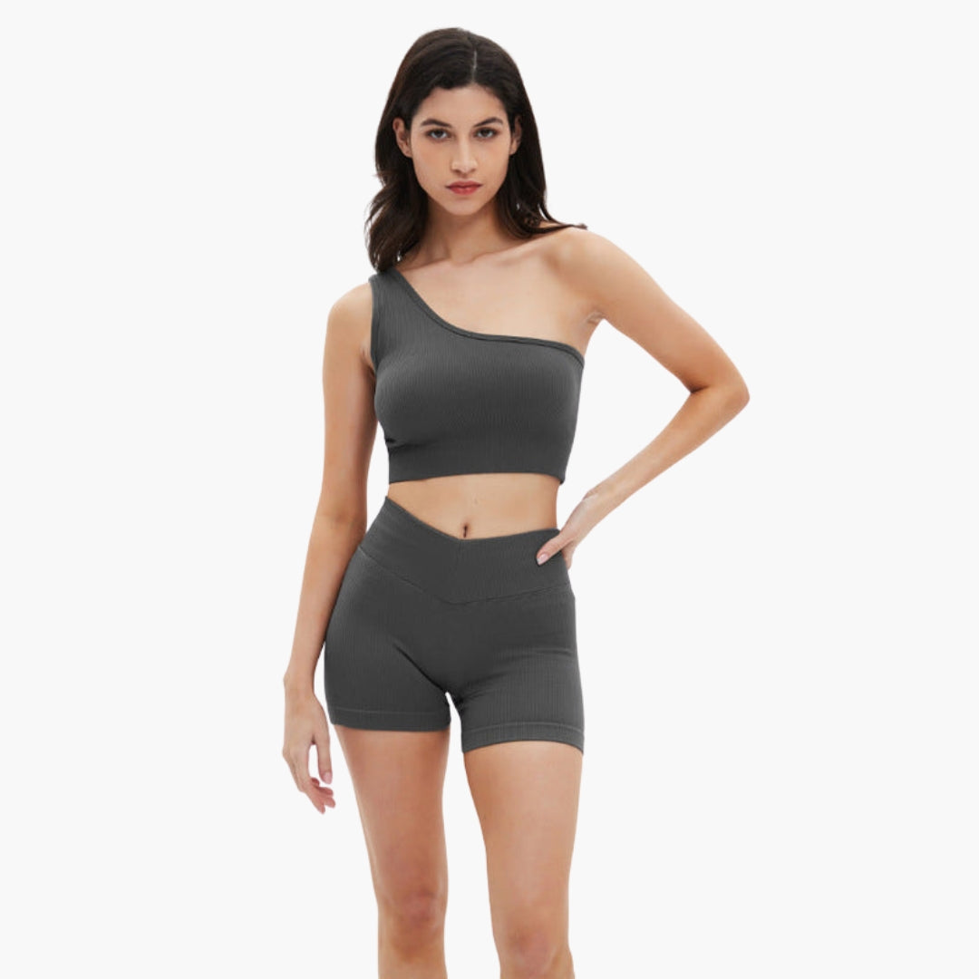 Women's ribbed one-shoulder crop top and high-waisted shorts set in a coordinated sporty style