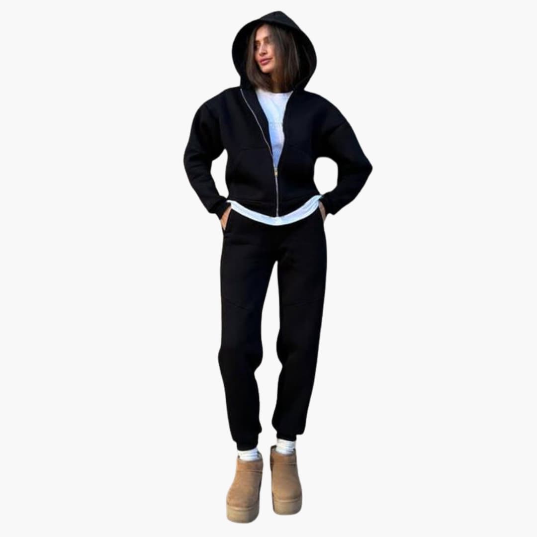 Women's gray long sleeve sports set with elastic waist pants and side pockets for training