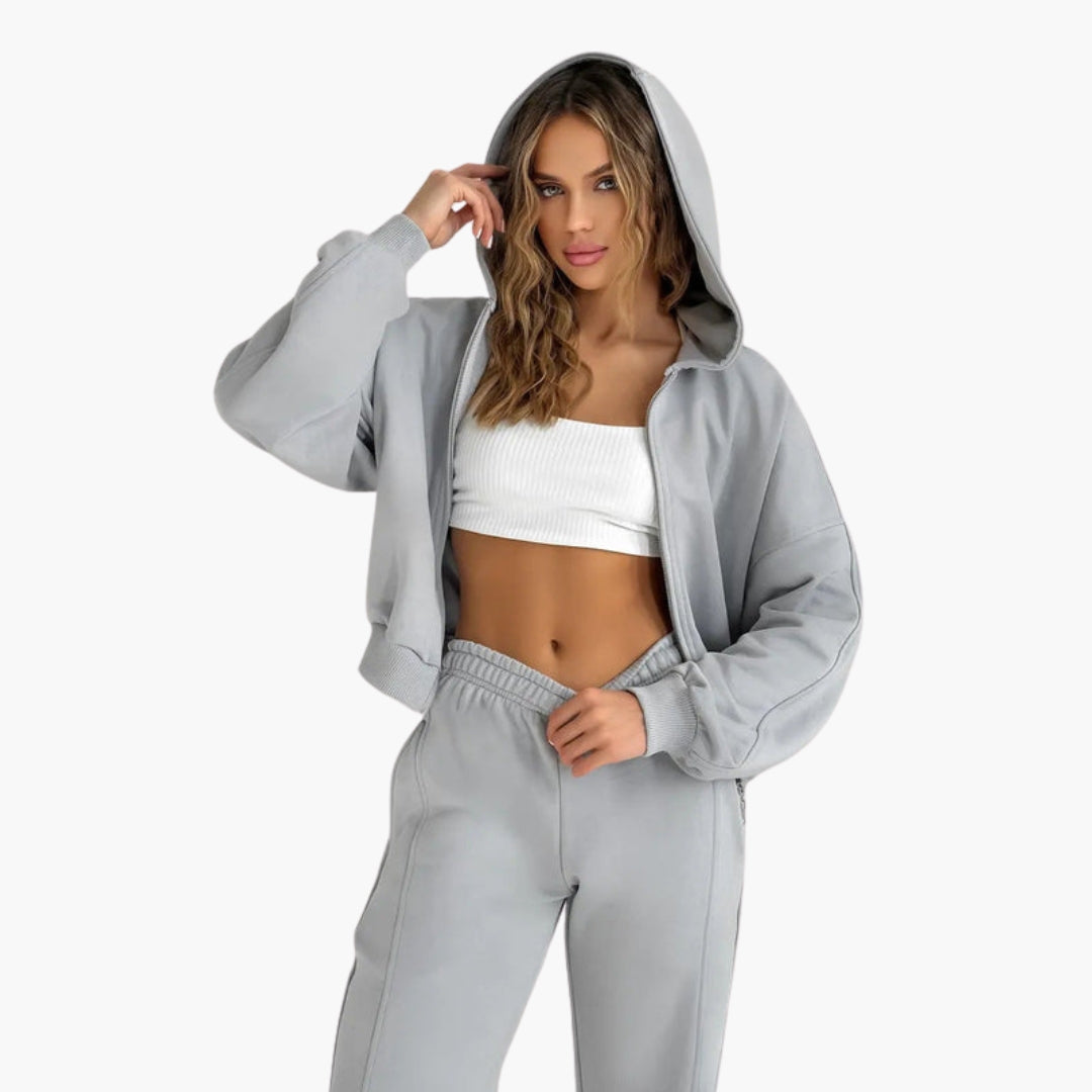 Women's zip hoodie jogger set with pockets, ribbed cuffs, elastic waistband, athleisure style