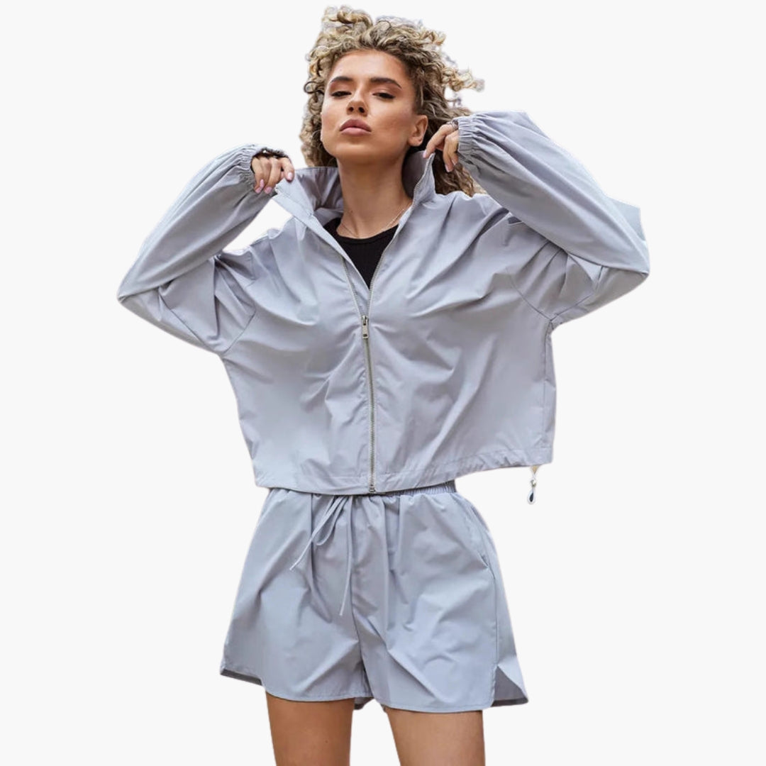 Women's navy zip-up track jacket and shorts set with stand-up collar and elastic waist