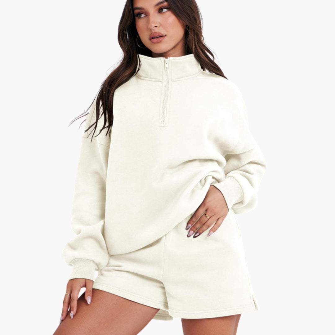 Women's relaxed beige zip-up high collar lounge set with matching shorts, cozy two-piece casual wear