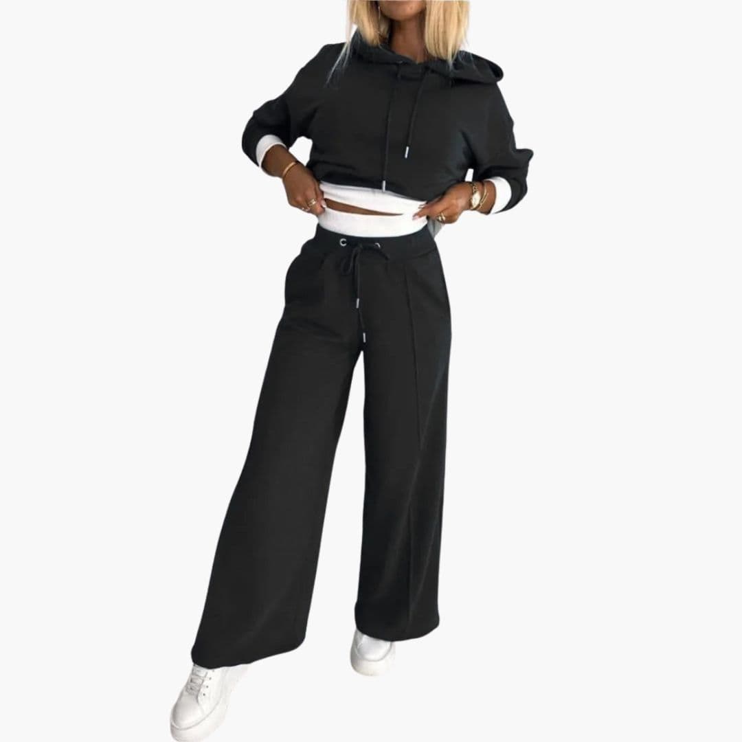 Women's gray hooded two-piece set with wide-leg pants, drawstring waist, relaxed fit, and side pockets