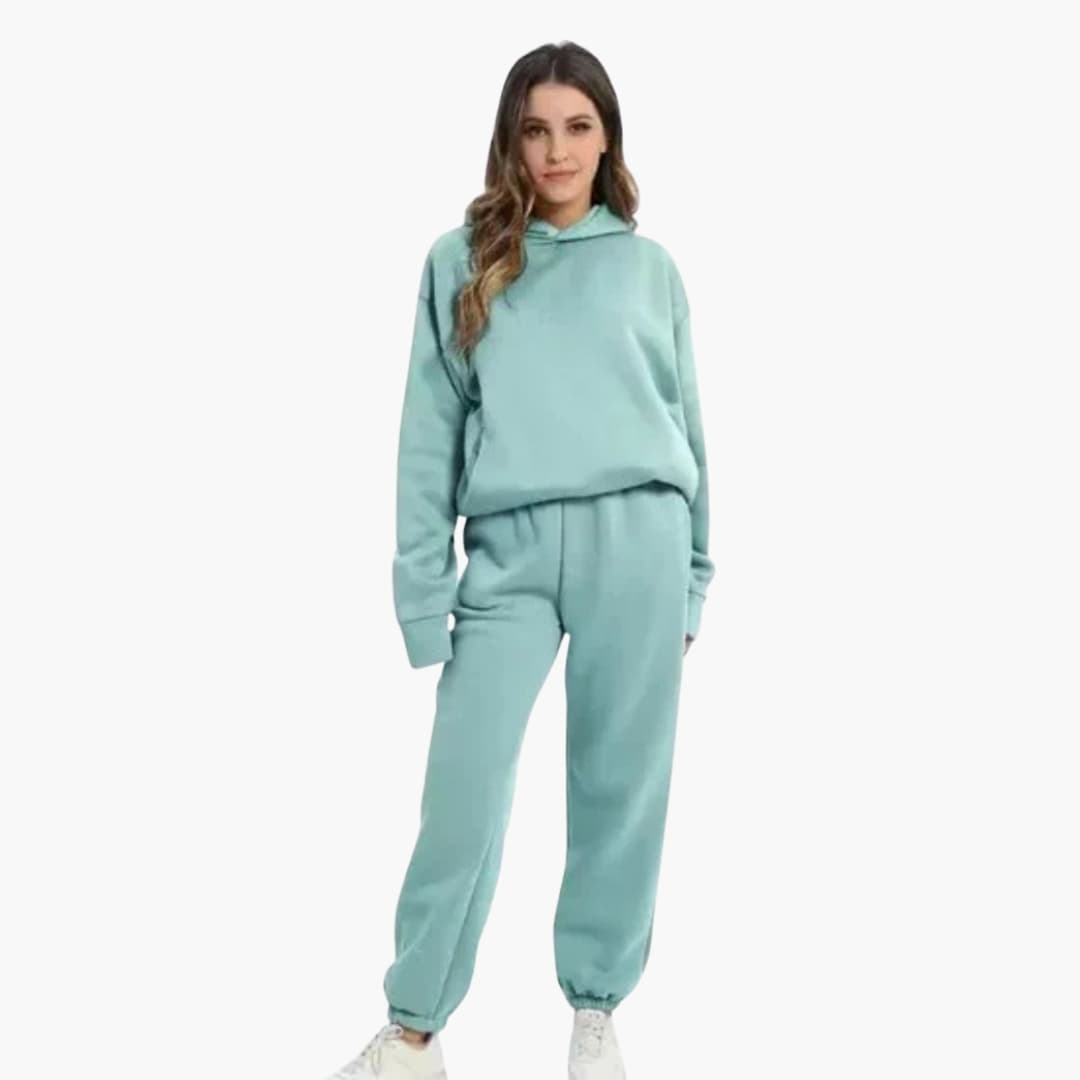 Women's gray hoodie jogger set with elastic waist, pockets, and fitted hood for everyday comfort