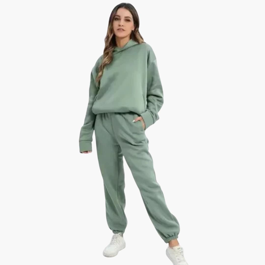Women's heather gray hoodie and jogger set with elastic waist, pockets, and fitted hood