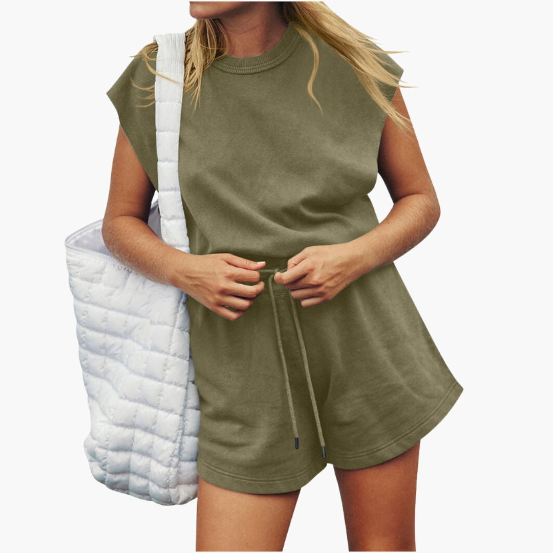 Women's gray athletic two-piece set with drawstring shorts, relaxed short-sleeve top, and elastic waist