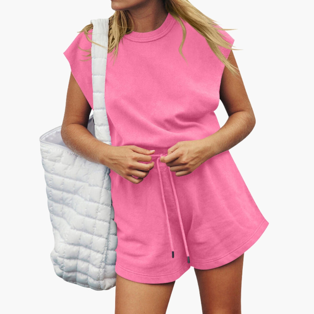 Women's light blue activewear set with short-sleeve top and drawstring shorts, elastic waist