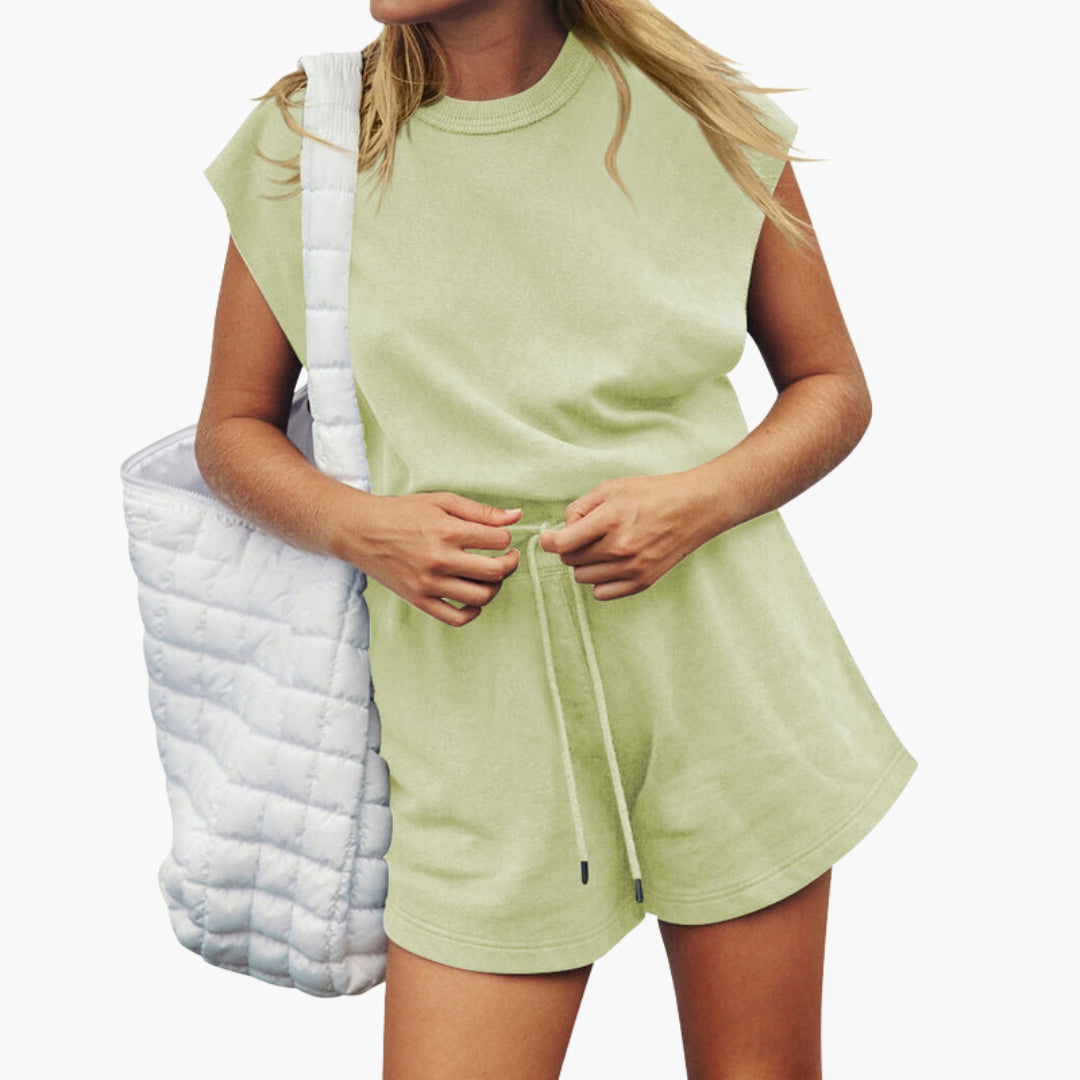 Women's solid activewear shorts set with short-sleeve top, elastic waist, and drawstring closure