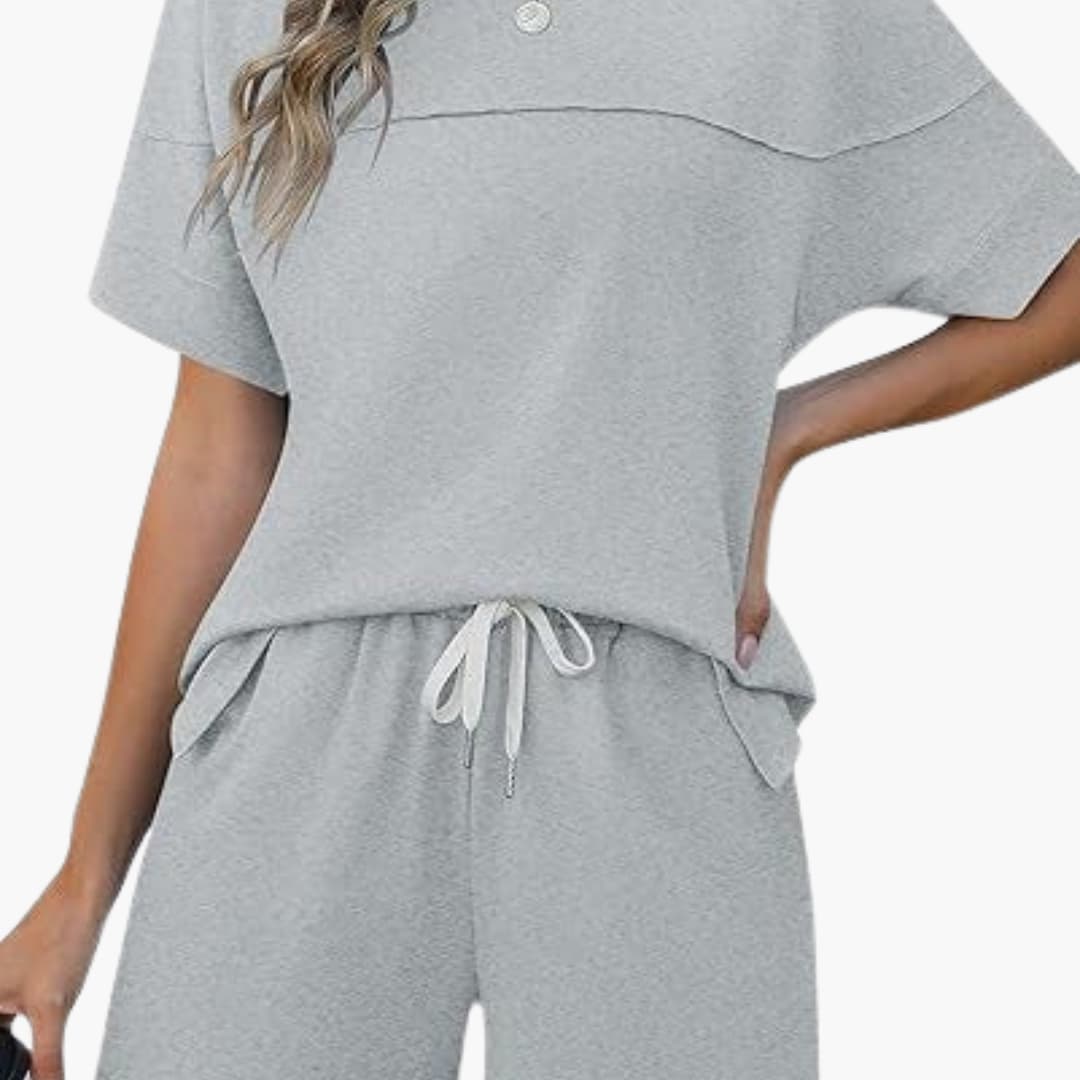 Women's two-piece sportswear set with short sleeve round-neck top and matching elastic waist shorts