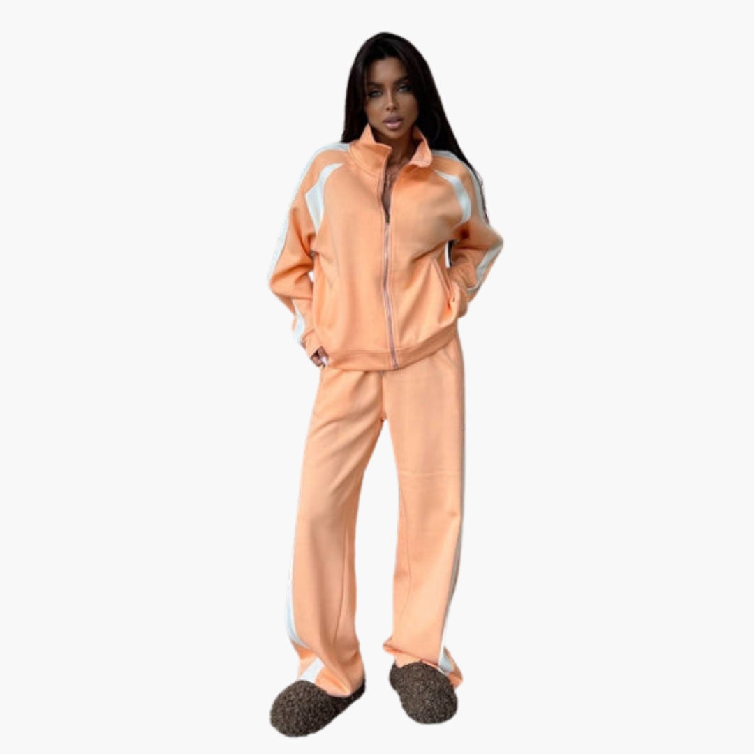 Women's zip-up tracksuit set in solid color with stand-up collar and bold contrasting stripes