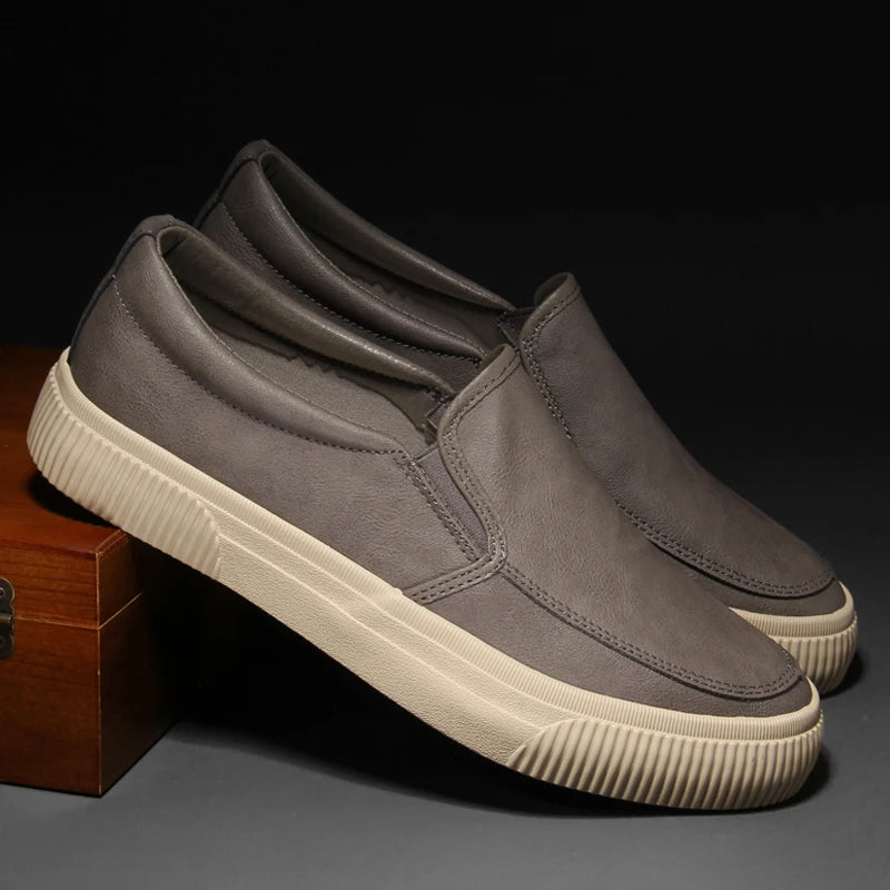 Men's matte black genuine leather slip-on loafers with cushioned sole, sleek minimalist urban style