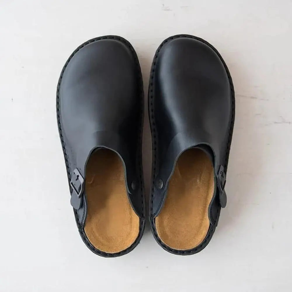 Women's slip-on ergonomic clogs in black, navy, and beige with classic supportive design for all-day comfort