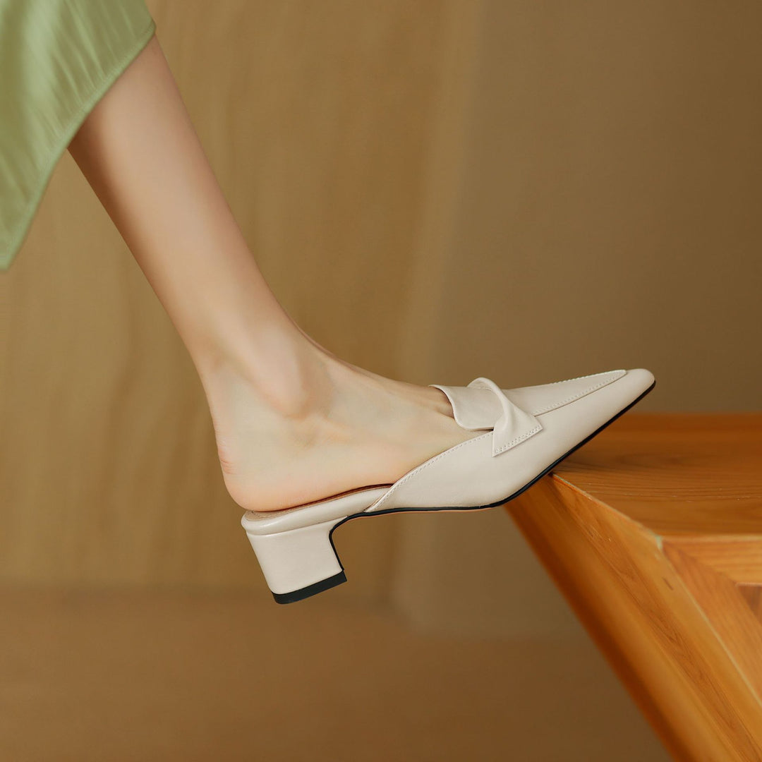 Women's tan leather slip-on mules with bow-trim detail, breathable upper, elegant desk-to-dinner style