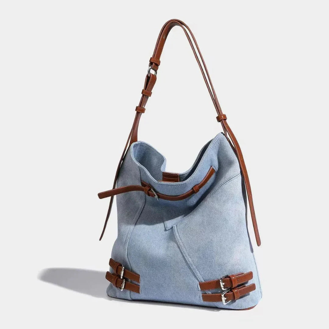 Women's everyday denim carryall bag with faux leather accents, spacious storage, magnetic closure