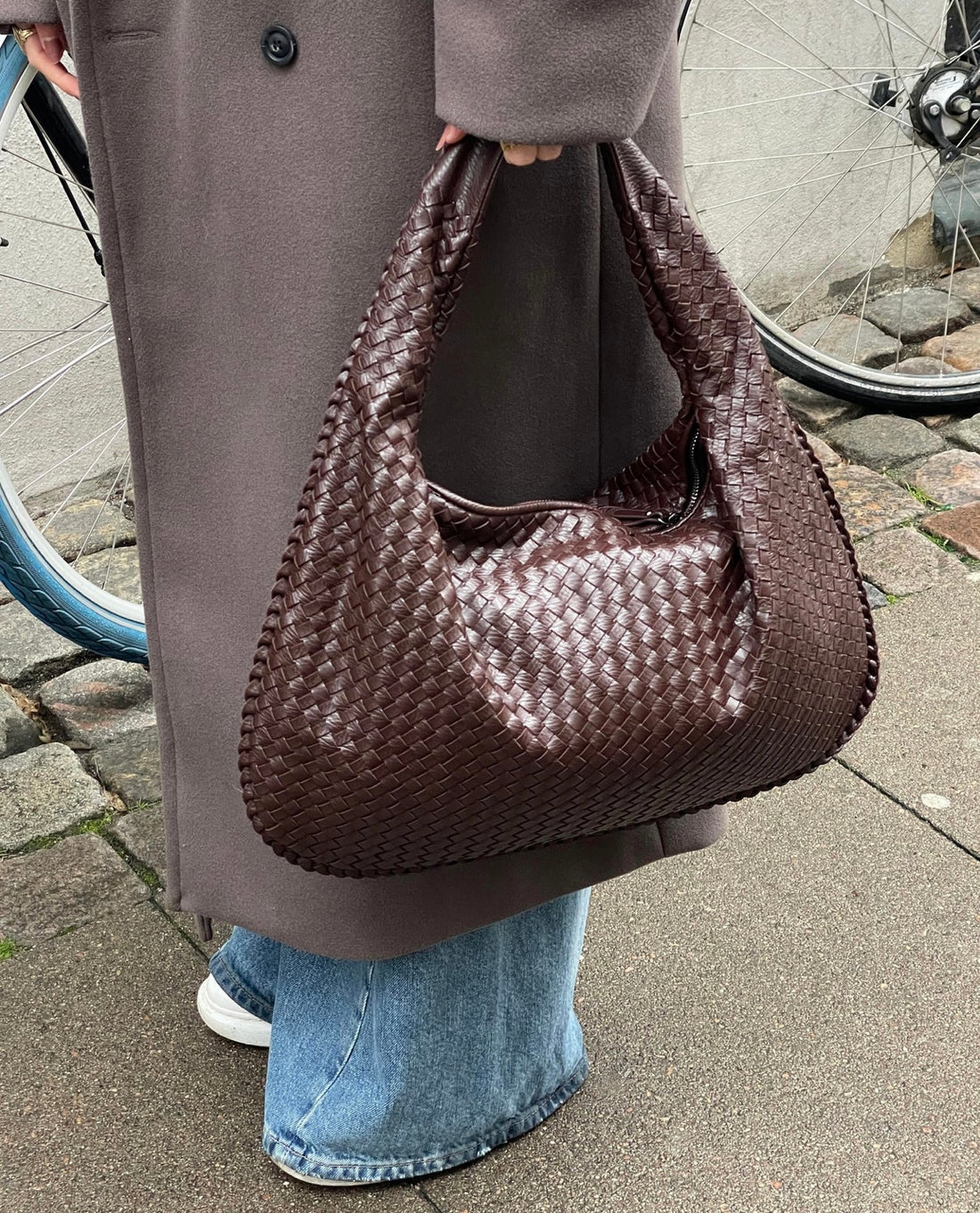 Handcrafted wicker tote bag in natural beige vegan leather, versatile everyday carryall with timeless style