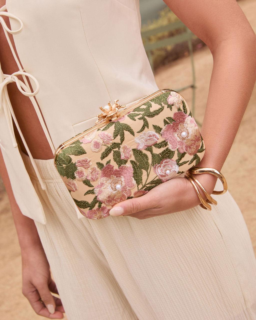 Ivory satin hard case clutch with floral embroidery and faux pearl accents, gold hardware