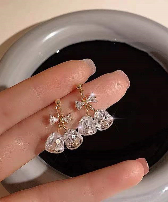 Boucles d'oreilles pendantes en zircon doré et cuivré, style tendance, avec nœud et clochette. - Urbann-Vibe