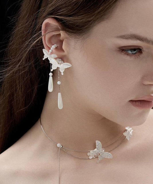 Boucles d'oreilles pendantes en argent sterling blanc avec perles et papillon - Urbann-Vibe